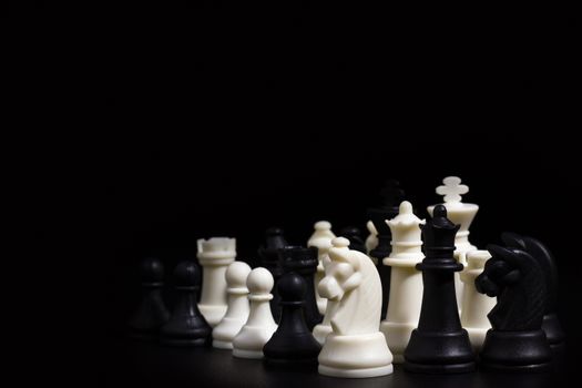 Chess in darkness on black background. Business planning concepts.