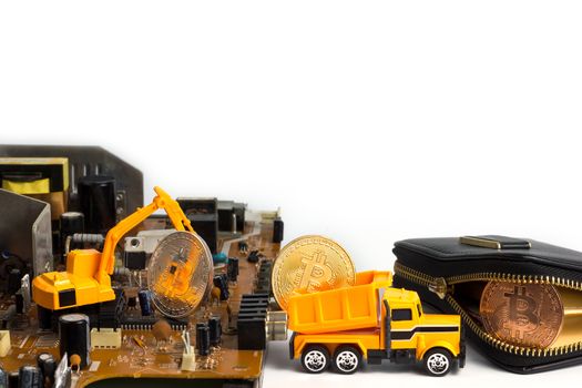 Backhoe dig bitcoin on mainboard put in the truck and transport it to the leather wallet. Concept of bitcoin mining business.