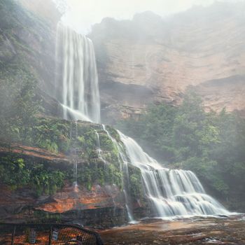 Fine rain, fog and waterfall spray fill the air as the swollen creeks tumble over cliff ledges and cascade over rocks