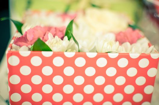 Beautiful bouquet of mixed flowers of chrysanthemums, cloves and roses. background on full screen in a box