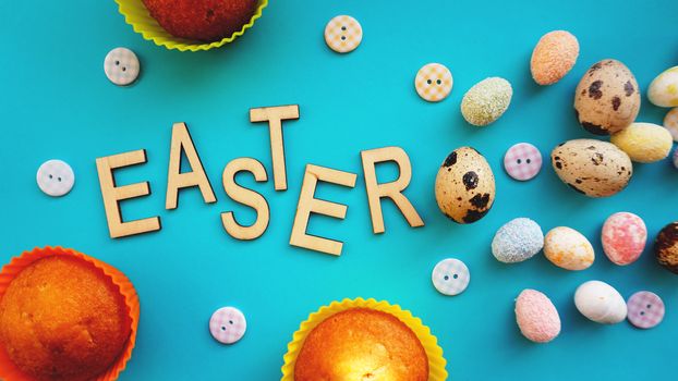 Quail Easter eggs on blue background. Flat lay, top view. Easter concept banner. Easter text