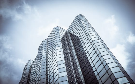 Abstract Diagonal Perspective Of A Towering Downtown Glass And Steel Skyscraper With Copy Space