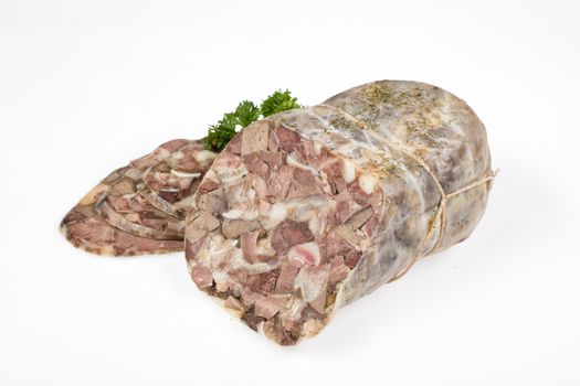 Ham and greenery on an isolated studio background