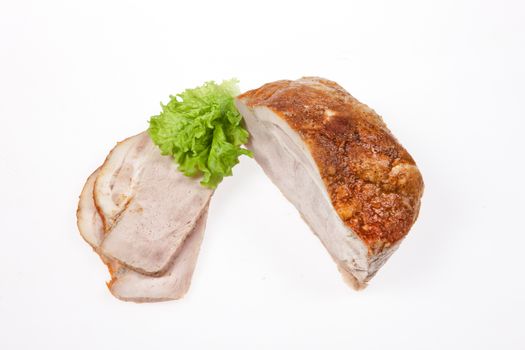 Ham and greenery on an isolated studio background