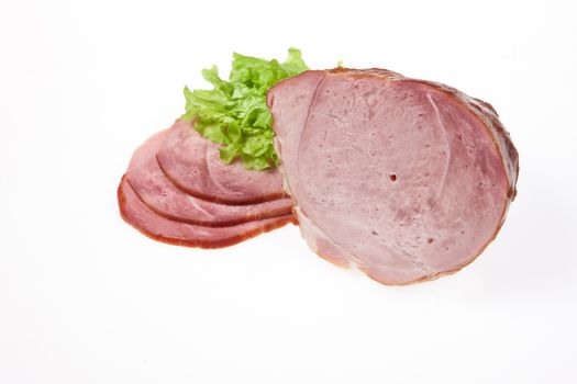 Ham and greenery on an isolated studio background