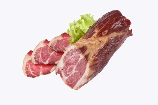 Ham and greenery on an isolated studio background