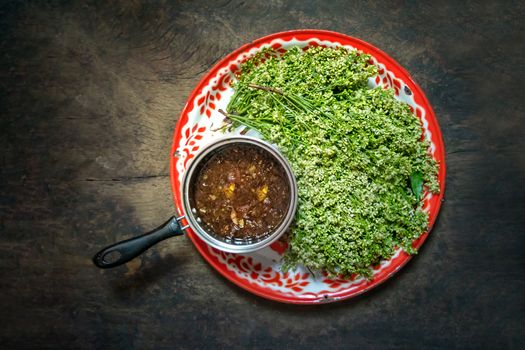 Blanched Neem tree blossoms served with sweet and sour dip , Thai style food