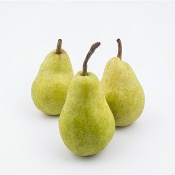 Three pears isolated on a white surface