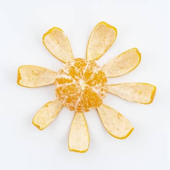 a tangerine peeled on a white surface