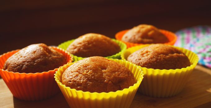 Simple mini muffins in colorful silicone bakeware. Free space. Selective focus. Closeup