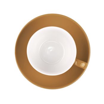 One beige brown empty coffee or tea cup with saucer isolated on white background, elevated top view, directly above