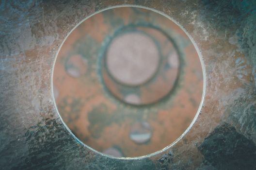 Holes made in a metallic table create this circle pattern on the rusty surface in San Pedro de Atacama, Chile