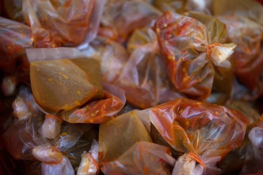 Chili sauce pack in plastic bag ready for takeaway.