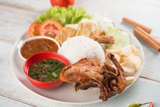 Nasi lemak kukus with fried chicken, popular traditional Malaysian local food.