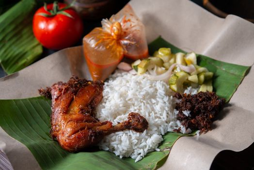 Nasi lemak kukus with chicken, popular traditional Malay local food.