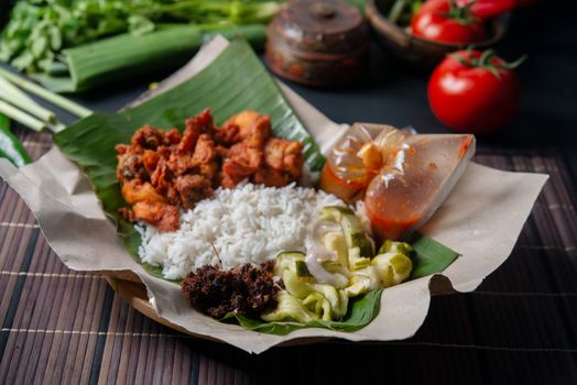 Nasi kukus ayam berempah, popular traditional Malay local food.