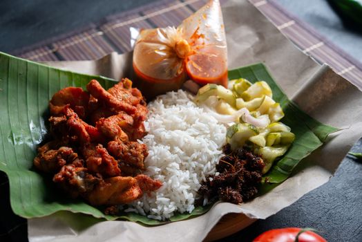 Nasi kukus ayam berempah, popular traditional Malay local food.