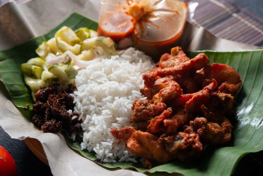 Nasi kukus ayam berempah, popular traditional Malay local food.