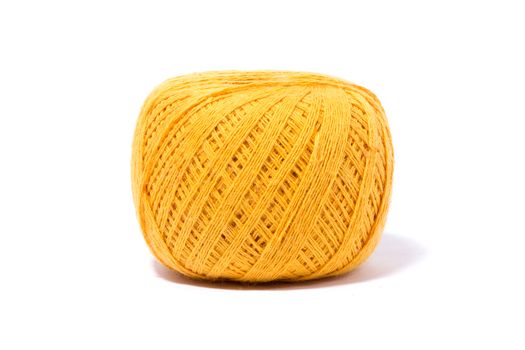 a ball of yellow knitting yarn, isolate, homemade handicrafts, woolen yarn