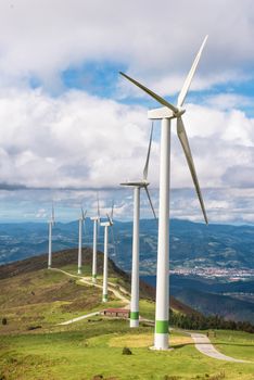 Renewable energy. Wind turbines, eolic park in scenic landscape of basque country, Spain.