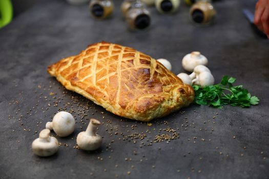 Fillet steak coated with pate de foie gras and duxelles, which is then wrapped in puff pastry and baked