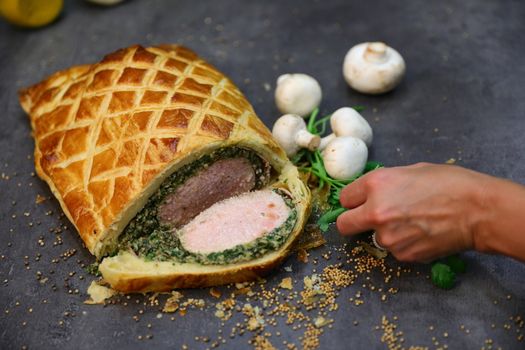 Fillet steak coated with pate de foie gras and duxelles, which is then wrapped in puff pastry and baked