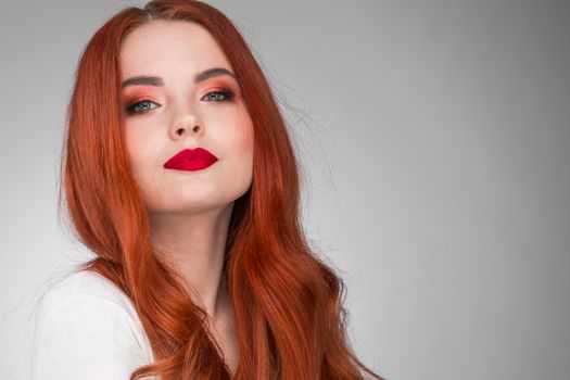 Portrait of young woman with long beautiful ginger hair