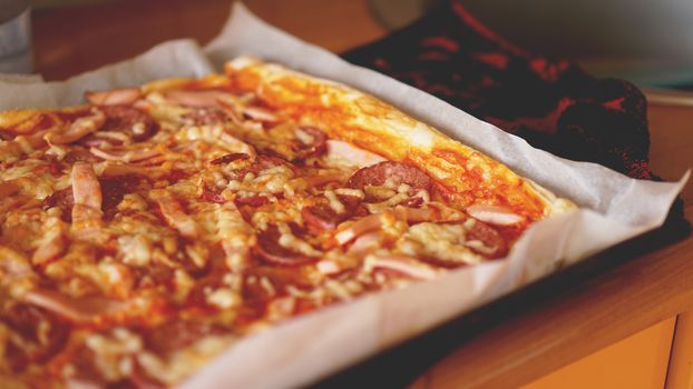 Simple Homemade Pizza on a rustic wooden table.