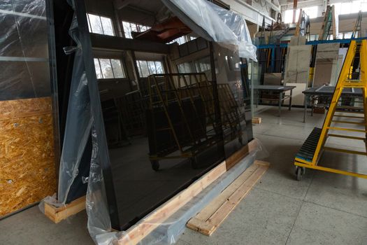The interior of a large glass and mirror cutting factory