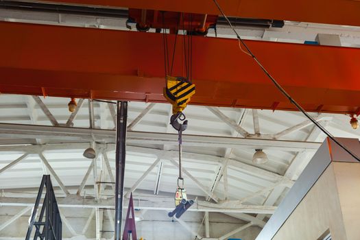 Factory bridge crane for lifting cargo in an enterprise