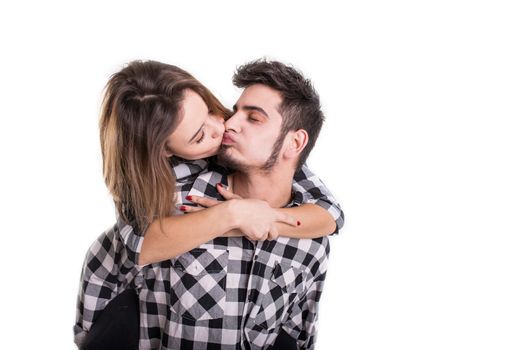 Happy young couple embracing each other and kissing isolated on white background