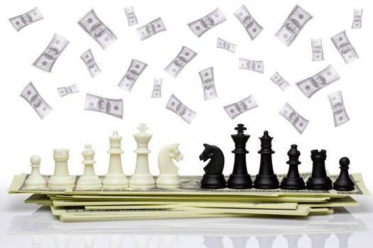 Chess face each other on a dollar banknote and dollar is falling from the top. Concept of business strategy or business war. Isolate on white background with clipping path.