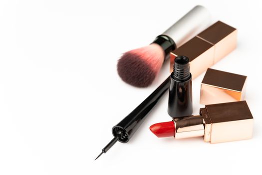 Many cosmetics for makeup and beauty of women on white background. Copy space for text or articles about beauty.