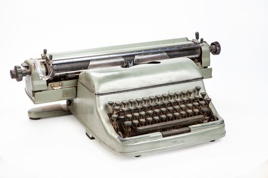 Old typing machine on an isolated studio background