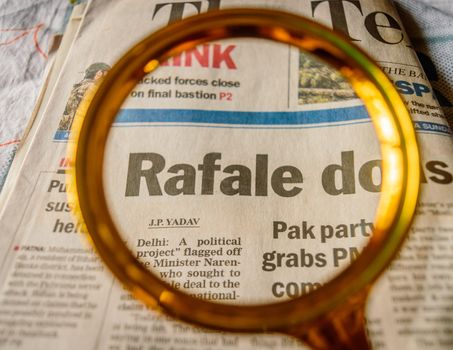 Kolkata, India, 18th March, 2019: The word Rafale under scanner in an english newspaper.
