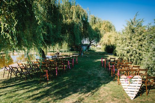 wedding ceremony area, arch chairs decor with trees