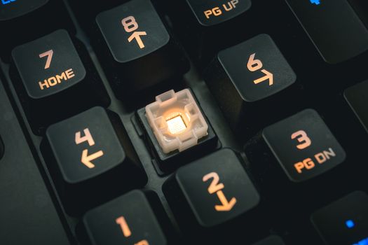 Backlit mechanical keyboard numerical buttons detail shot. Gaming Keys.