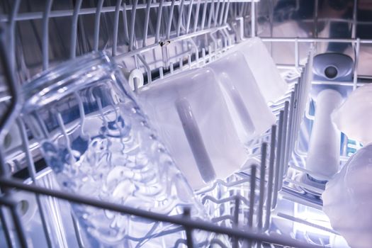 Dishes in the open dishwasher, Inside, clean dishware