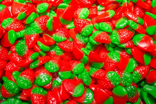 Jelly strawberries, sweet candy colorful detail texture. Candy store photo.