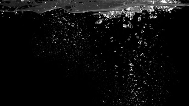 Blurry images of soda liquid water bubbles or carbonate drink or oil shape or beer fizzing or splashing and floating drop in black background for represent sparkling and refreshing