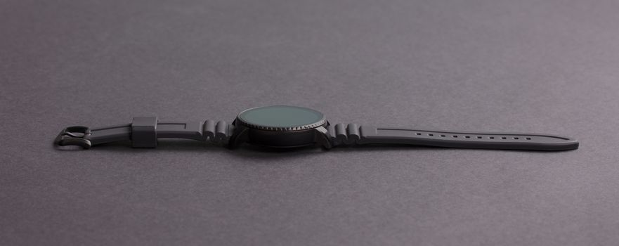 Black smartwatch isolated on a black background
