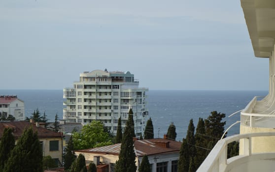 Sea view and hotel buildings from the balcony, early morning.