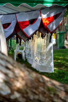 Life jackets drying in the summer shed neat the river in Latvia. Life jackets on the Gauja shore.