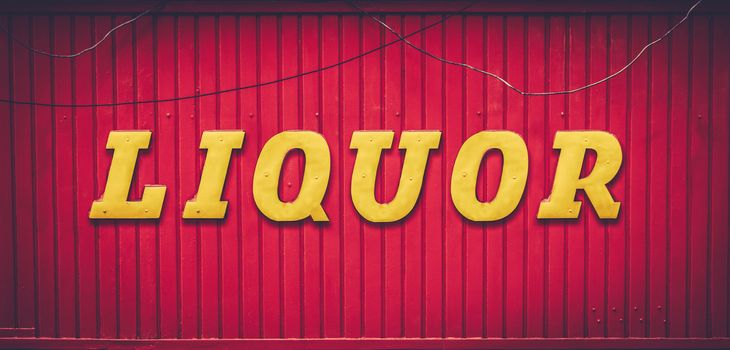 Grungy Urban Red And Yellow Liquor Store Sign