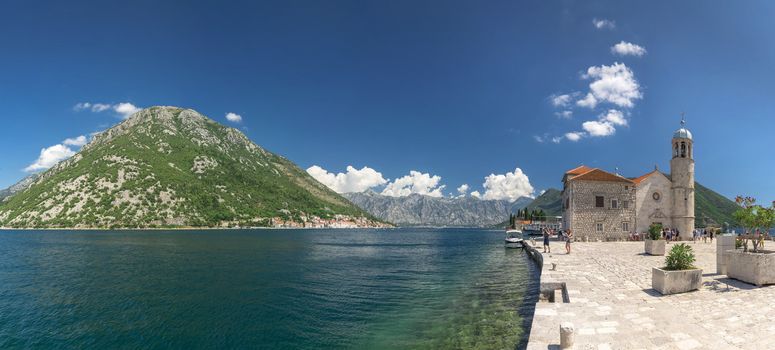 Perast, Montenegro - 07.11.2018.  Our Lady of the Rocks church on an Island in the Bay of Kotor, Montenegro,  in a sunny summer day