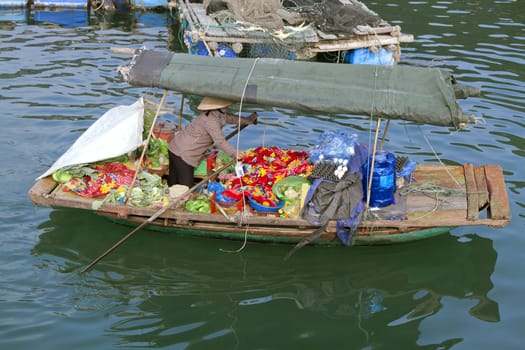 Floating market boat in Ha Long bay, Vietnam