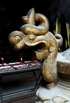 Dragon head - detail of a decorative incence burner in a Vietnamese temple
