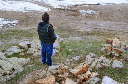 Man in the steppe looking at the winter landscape