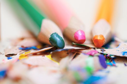 Closeup on sharpened colored pencils with shavings