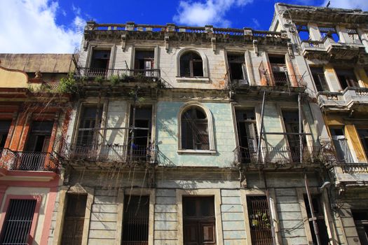 Facade of an old residential building with balconies in Havana, Cuba